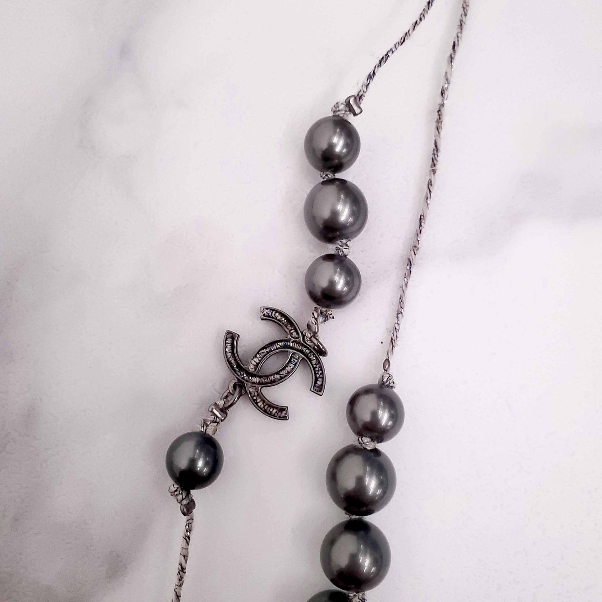 CHANEL GREY PEARL NECKLACE WITH METALLIC STRING DETAIL