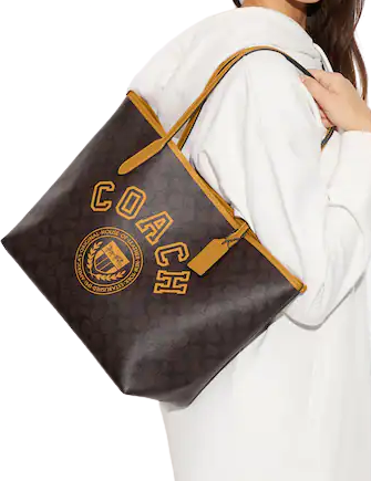 Coach City Tote In Signature Canvas With Varsity Motif